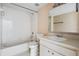 Functional bathroom with a shower-tub combo and a white vanity sink at 11022 Connacht Way, Tampa, FL 33610