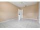 Neutral bedroom featuring tile floors, overhead fan and view into the house at 11022 Connacht Way, Tampa, FL 33610