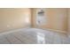 Bright bedroom featuring tile floors, neutral walls, and a window at 11022 Connacht Way, Tampa, FL 33610