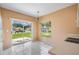 Bright dining area features sliding glass doors to the patio and a view of the backyard at 11022 Connacht Way, Tampa, FL 33610