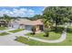 Angle shot of a beautiful single Gathering home in a quiet neighborhood with a sidewalk at 11022 Connacht Way, Tampa, FL 33610