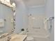 Well-lit bathroom featuring a vanity, framed mirror, and shower-tub combo at 1112 Mcdaniel St # 78, Sun City Center, FL 33573