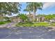 A well-maintained home with lush lawn, palm trees, and a brick-paved driveway offers great curb appeal at 1112 Mcdaniel St # 78, Sun City Center, FL 33573