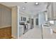 Kitchen featuring stainless appliances, lots of storage, tile floors and easy access to living room at 1112 Mcdaniel St # 78, Sun City Center, FL 33573
