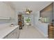 Charming eat-in kitchen area boasting plenty of countertop space with an antique china cabinet at 1112 Mcdaniel St # 78, Sun City Center, FL 33573