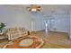 Comfortable living room with wood-look tile and access to various rooms, bathed in natural light at 1112 Mcdaniel St # 78, Sun City Center, FL 33573