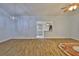 An open-concept living area with wood-look tile flooring seamlessly connects to the kitchen and dining spaces at 1112 Mcdaniel St # 78, Sun City Center, FL 33573
