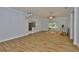 Spacious living room featuring wood-look tile flooring, crown molding, and ample natural light at 1112 Mcdaniel St # 78, Sun City Center, FL 33573
