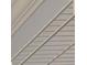 Close-up of gray horizontal siding on a building showing texture and design at 1112 Mcdaniel St # 78, Sun City Center, FL 33573