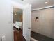 Ensuite bathroom with tiled walk-in shower; bedroom in the background at 13637 13Th St, Dade City, FL 33525