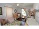 Charming Bedroom with hardwood floors, soft pink accents, and a cozy atmosphere at 13637 13Th St, Dade City, FL 33525