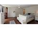 Bright bedroom featuring hardwood floors, white trim, lots of closets and natural light at 13637 13Th St, Dade City, FL 33525