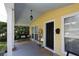 Inviting front porch featuring a porch swing, outdoor decor, and ample space for relaxation at 13637 13Th St, Dade City, FL 33525