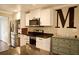 Kitchen close up featuring stainless appliances, white cabinets and a view of the letter M at 13637 13Th St, Dade City, FL 33525