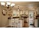Kitchen with island seating, stainless appliances, modern lighting, and access to outdoor space at 13637 13Th St, Dade City, FL 33525