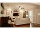 Cozy living room with hardwood floors, neutral walls, ceiling fan, and comfortable seating at 13637 13Th St, Dade City, FL 33525