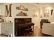 Living room with a piano, hardwood floors, stylish decor, and a spacious layout at 13637 13Th St, Dade City, FL 33525