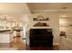 Open-concept space featuring hardwood floors, stylish decor, a piano, and a well equipped modern kitchen at 13637 13Th St, Dade City, FL 33525