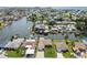 Picturesque aerial view of a waterfront community with canals, private docks, and well-maintained properties at 13909 Berkowitz Ave, Hudson, FL 34667