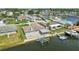 A waterfront home boasts a covered patio, boat lift, and easy access to the water at 13909 Berkowitz Ave, Hudson, FL 34667