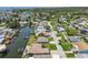 Aerial shot showcases a vibrant waterfront neighborhood with direct access to tranquil canals and waterways at 13909 Berkowitz Ave, Hudson, FL 34667