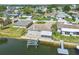 This waterfront home offers a boat lift, dock, screened in lanai, and beautiful curb appeal at 13909 Berkowitz Ave, Hudson, FL 34667
