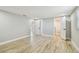 Spacious bedroom featuring wood-look flooring and several doorways at 13909 Berkowitz Ave, Hudson, FL 34667