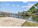 The dock offers waterfront access and scenic views of the canal and surrounding properties at 13909 Berkowitz Ave, Hudson, FL 34667