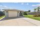 Long driveway leading to the attached garage in a well-maintained home at 13909 Berkowitz Ave, Hudson, FL 34667