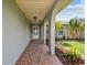 Inviting entryway featuring decorative mosaic tile flooring and stone accents at 13909 Berkowitz Ave, Hudson, FL 34667