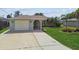 Charming single-story home with well-manicured lawn and attached one-car garage at 13909 Berkowitz Ave, Hudson, FL 34667