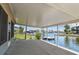 Spacious outdoor lanai with views of the canal and waterfront at 13909 Berkowitz Ave, Hudson, FL 34667