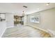 Bright living room features a sliding glass door to sunroom and beautiful views of the canal at 13909 Berkowitz Ave, Hudson, FL 34667