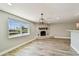 Living room features a stone fireplace, recessed lighting, and hardwood floors at 13909 Berkowitz Ave, Hudson, FL 34667