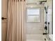 Close-up of modern shower with marble tile at 13909 Berkowitz Ave, Hudson, FL 34667
