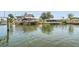Waterfront home featuring a private boat dock, boat lift, and direct access to the open water at 13909 Berkowitz Ave, Hudson, FL 34667
