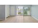 Interior view through the balcony doors featuring tile flooring, closet, and waterfront views at 14800 Walsingham Rd # 1215, Largo, FL 33774