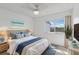 Bright bedroom with a ceiling fan, a comfortable bed and view from the window at 14800 Walsingham Rd # 1215, Largo, FL 33774