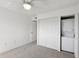 Clean, carpeted bedroom with a washer/dryer inside of closet at 14800 Walsingham Rd # 1215, Largo, FL 33774