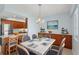 Cozy dining area adjacent to kitchen with seating for six and beach-themed décor at 14800 Walsingham Rd # 1215, Largo, FL 33774