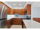 Modern kitchen with stainless steel appliances and countertop at 14800 Walsingham Rd # 1215, Largo, FL 33774