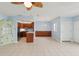 Bright and open living space with tile flooring and kitchen view at 14800 Walsingham Rd # 1215, Largo, FL 33774