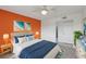 Cozy main bedroom with ocean-themed decor, en-suite bathroom, and a comfortable bed at 14800 Walsingham Rd # 1215, Largo, FL 33774