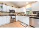 Well-lit kitchen featuring granite countertops, stainless steel appliances, and ample storage at 1626 Terra Ceia Bay Cir # 6, Palmetto, FL 34221