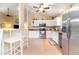 Bright kitchen with white cabinets, stainless steel appliances, and breakfast bar seating at 1626 Terra Ceia Bay Cir # 6, Palmetto, FL 34221