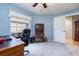 Bright home office with ceiling fan, large window, desk, bookcase, and light blue paint at 1626 Terra Ceia Bay Cir # 6, Palmetto, FL 34221
