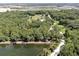 Beautiful view of a large property, lake and surrounding community at 1753 Ranchette Rd, Wesley Chapel, FL 33543