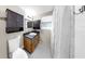 Functional bathroom with dark vanity, and enclosed shower at 1753 Ranchette Rd, Wesley Chapel, FL 33543