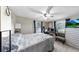 Comfortable bedroom with soothing decor, ample natural light, and ceiling fan at 1753 Ranchette Rd, Wesley Chapel, FL 33543