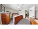 Inviting bedroom featuring wood furnishings, a ceiling fan, and an open doorway, blending comfort and convenience at 1753 Ranchette Rd, Wesley Chapel, FL 33543